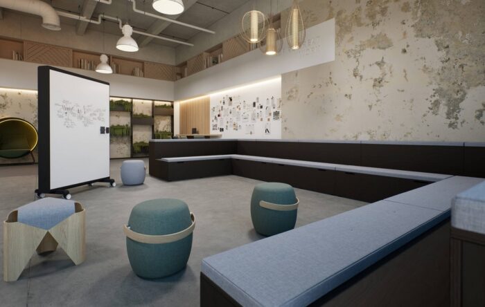 Platforms Modular Seating U shape configuration shown in a meeting space with a mobile white board and stools