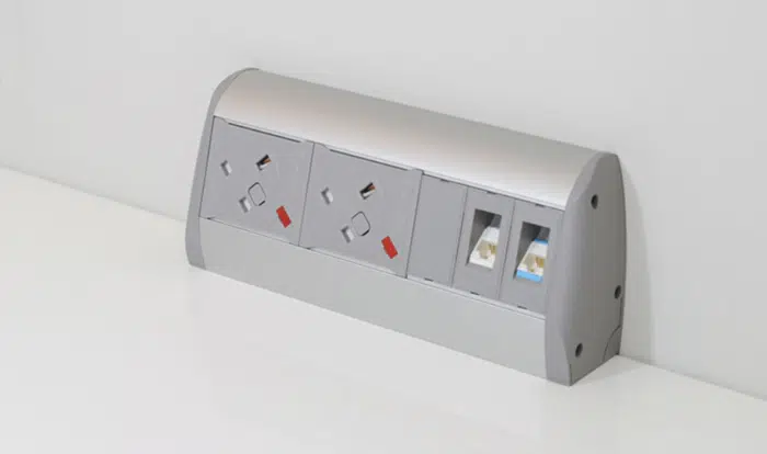 Poco Power Module shown as 2 gang silver and grey unit on a desktop