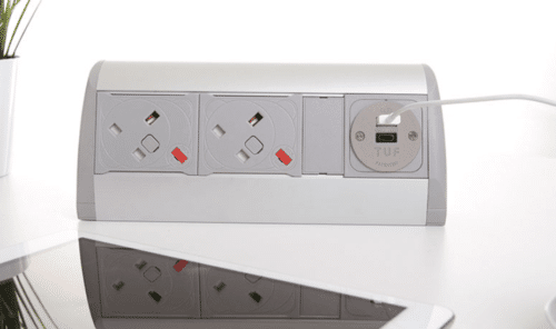 Poco Power And Data Module silver and grey unit with two power and twin USB charging on a desktop