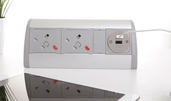 Poco Power Module in silver and grey with two power and twin USB charging on a desktop