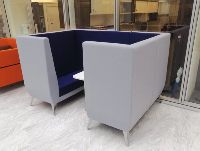 Polly Soft Seating mid back 4 seat den shown in an office space