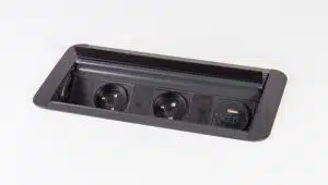 Prism Power Module shown open, in all black finish with two schuko power sockets and twin USB charging sockets