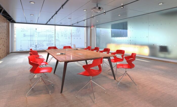 Pyramid Conference Tables with steel frame shown with red Aria chairs in a meeting room