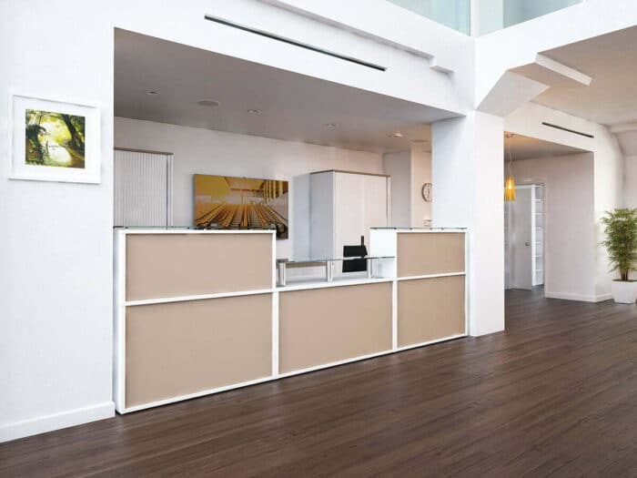 Receptiv Reception Desk in white with beige panels in the rear of the upstands