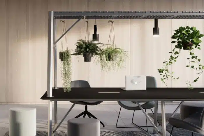 Relic Cloud Collaboration Table with a black worktop, white frame and hanging plants