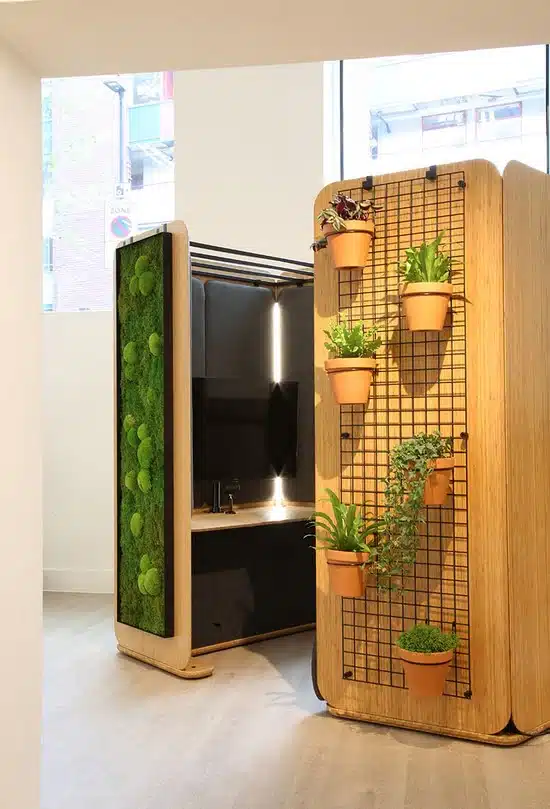 Retreat Zoning System 2 seater module with exterior mesh panel and a media centre module shown with exterior moss panel