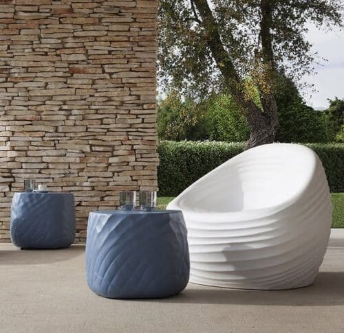 Riverside & River Stone Seating chair in white and two tables in blue on a patio