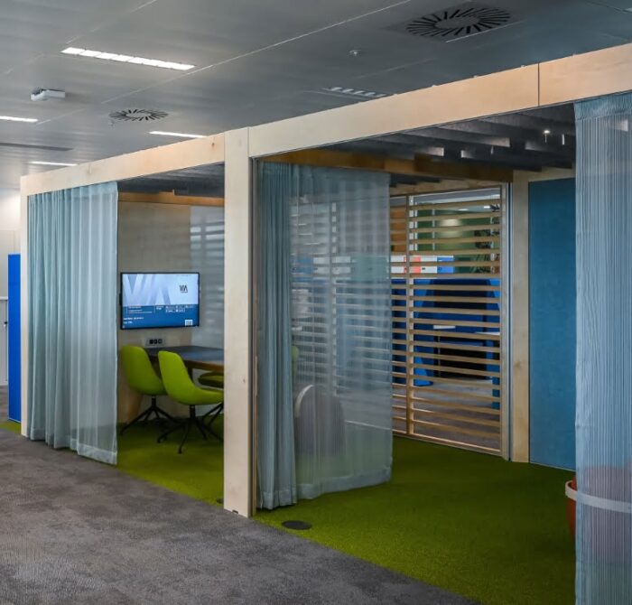 Rooms Collaboration Space shown with a combination of venetian trellis, curtain and media walls