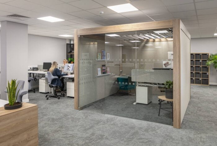 Rooms Collaboration Space with three upholstered walls and one glass door wall in an open plan office