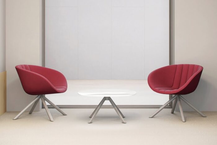 Runna Seating two low back chairs shown with a coffee table with white top and silver legs