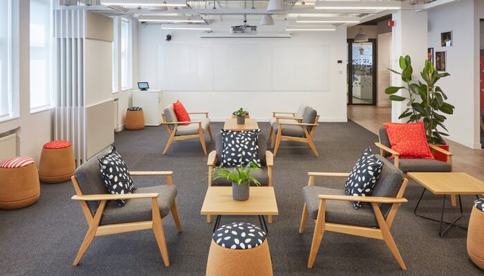 Scandi Lounge Chair - group of chairs with natural oak frames shown with coffee tables in a breakout space