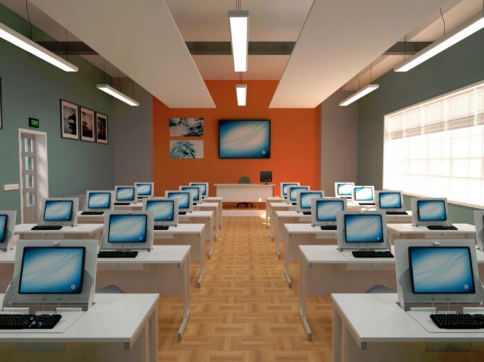 SmartTop Desk 12 banks of 2 side by side desks with white tops and white frames in a training room_classroom