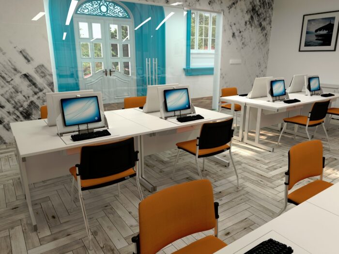SmartTop Desk banks of 4 back to back desks with white tops and white frames in a training room