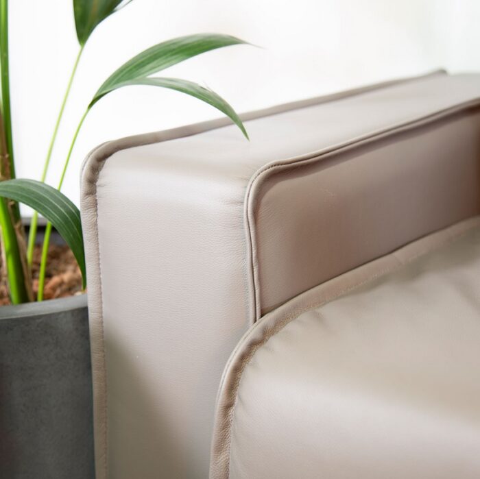Snug Modular Seating close up view of seating arm and seat cushion upholstered in leather