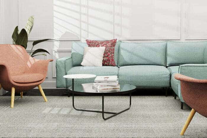 Snug Modular Seating four seat L shape configuration shown with an Orbit Coffee Table in a lounge area
