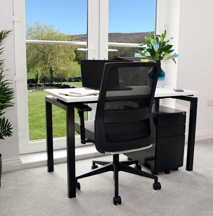 Soho2 Desks And Workstations small rectuangular desk with white integral sliding top and black lrame shown in a home office