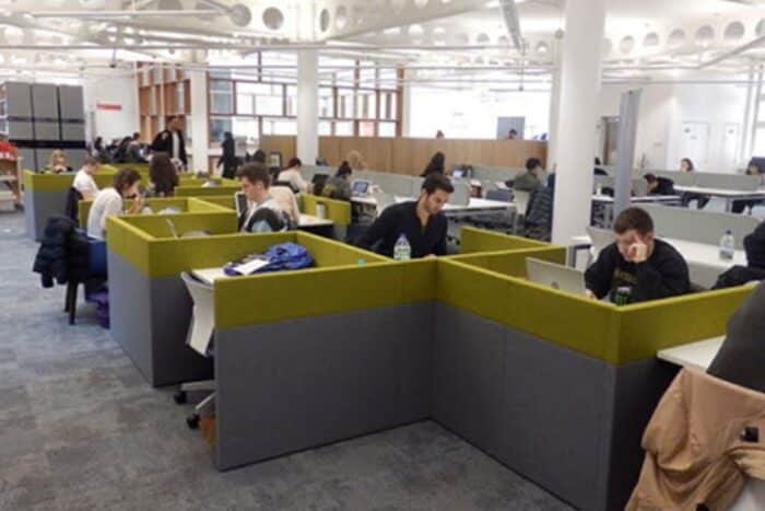 Solo Corral Study Booths group of booths in a workspace with grey and green upholstery