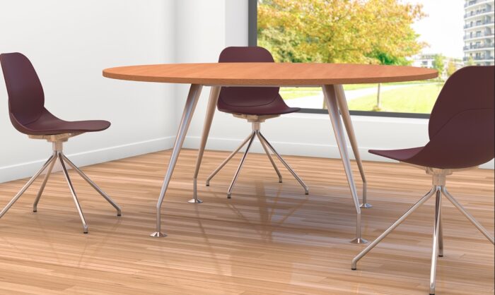 Spire Tables shown with round top in Beech finish and chrome painted legs shown with some meeting chairs