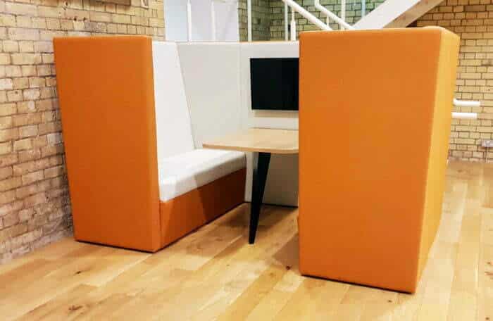 Stella Modular Seating high back den with table and mounted monitor with two tone upholstery