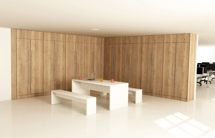 Storagewall shown as a corner configuration in a breakout space with bench table and seating