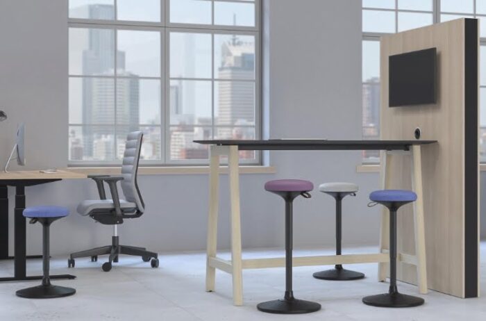 Sway Pivoting Stool four stools shown by a media station and a desk in a workspace