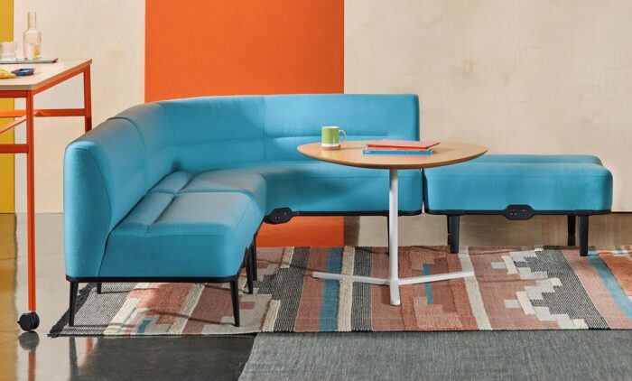 Talon Tables with a small soft triangle top shown by soft seating corner unit in a breakout space