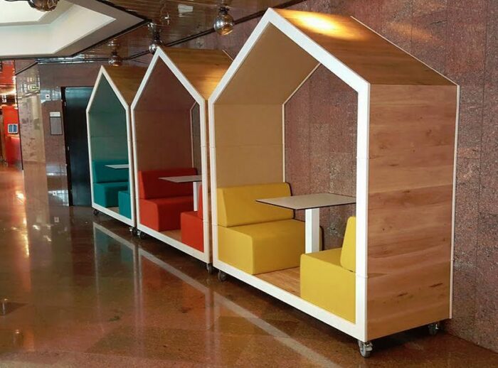 Treehouse Dual Booth group of three open booths in a row with seating and tables