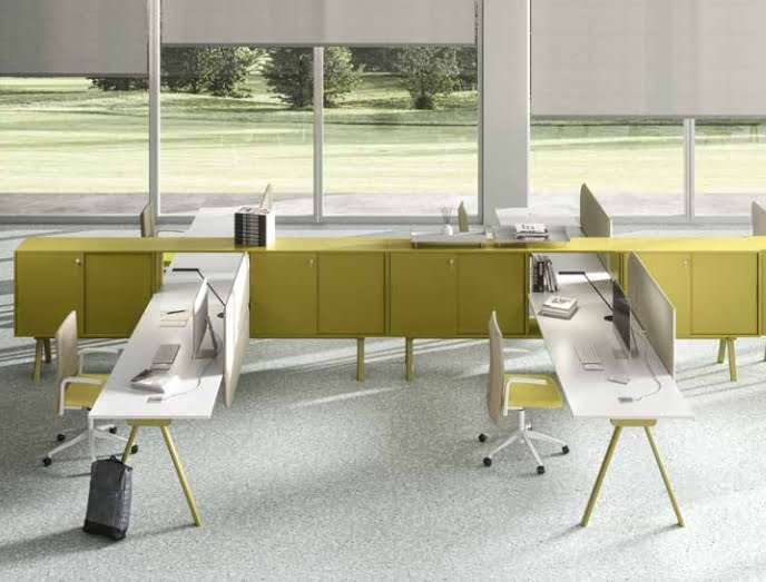 Workstation 2027 groups of X shape desks in a row shown in an office space