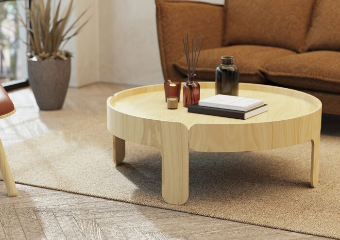 Wrapt Coffee Table in natural ash finish shown by a sofa in a lounge area
