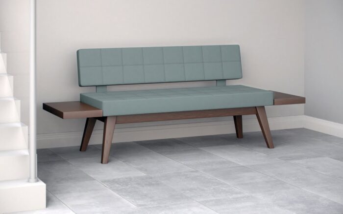 Xross Soft Seating upholstered double bench seat with integral side tables shown in an office space