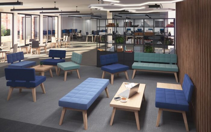 Xross Soft Seating various single and double upholstered seating units and tables shown in an open plan work space