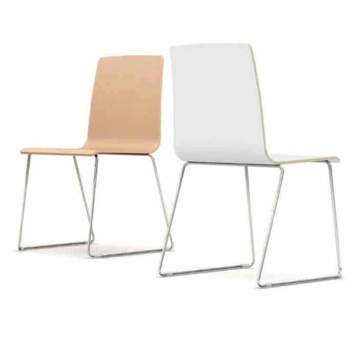 Two Bjorn breakout chairs - one in natural wood and one in whit elaminate