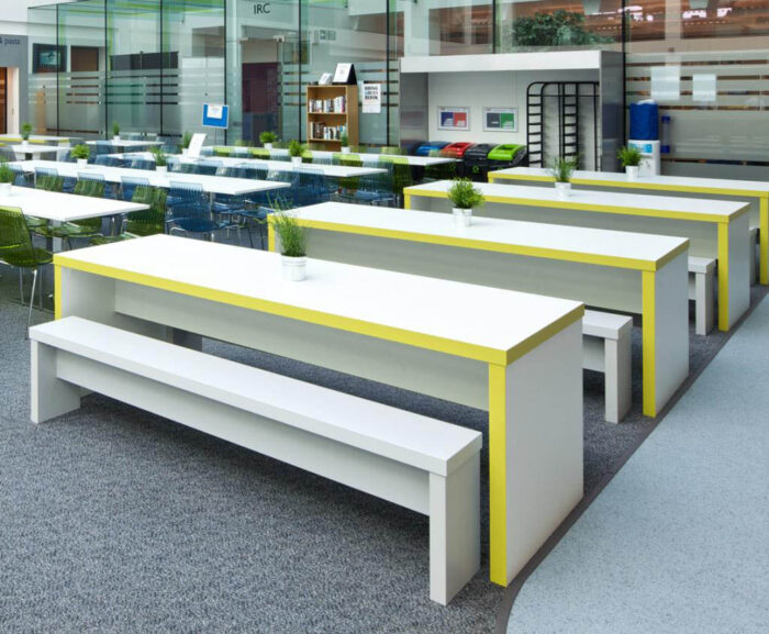 Block Breakout Tables and Benches in white laminate with yellow edging