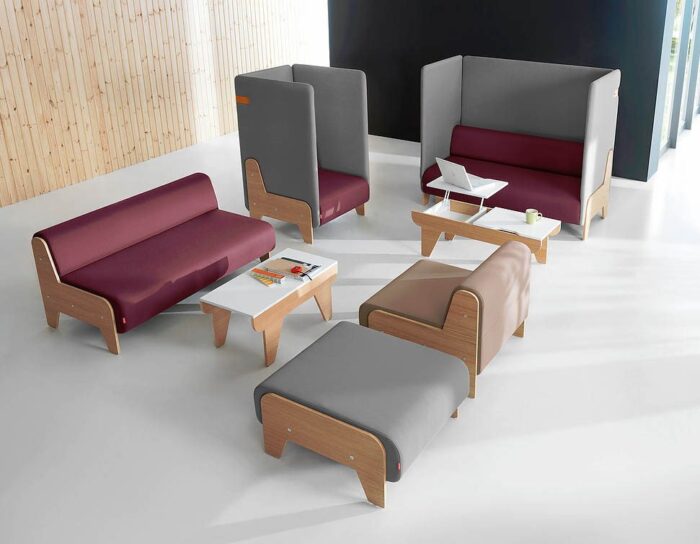Chillout Soft Seating low and high back single and double units shown with a table and a pouffe in a breakout space