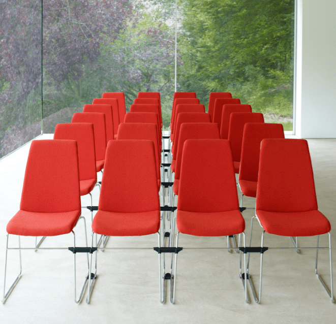 Confer Stacking Conference Chair showing rows of red chairs