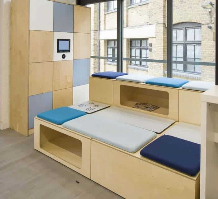 Coworking Lockers Shown Next To Tiered Seating