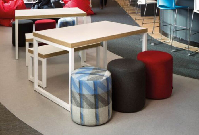 Drum Stools and a bench shown at a meeting table