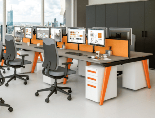Evolution Bench Desk shown with orange highlights on legs and pedestal handles