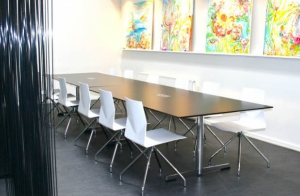 FourMat Meeting Table shown with white chairs