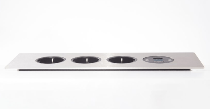 Podium Power Module showing the front view of 4 gang unit in silver with black sockets
